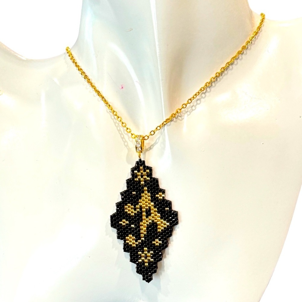 Handcrafted letter “A” leather-backed pendant necklace gold on black  20” chain